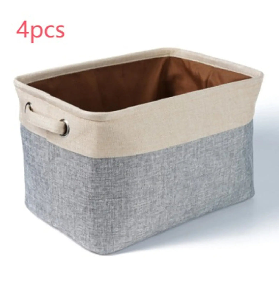 Beige and gray linen storage bin with metal ring handles, rectangular open design