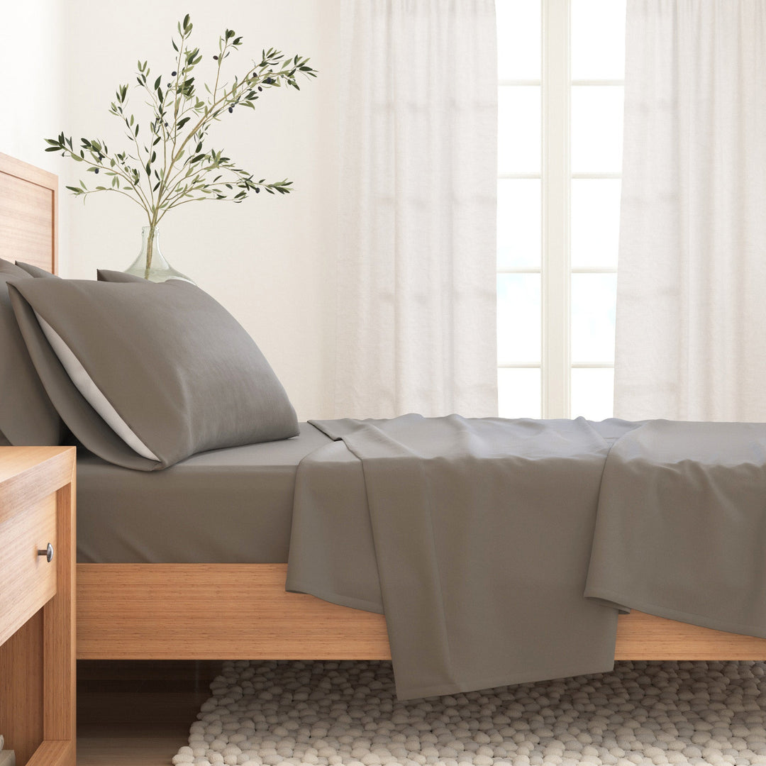 Grey cotton flannel sheet set on a bed with matching pillow