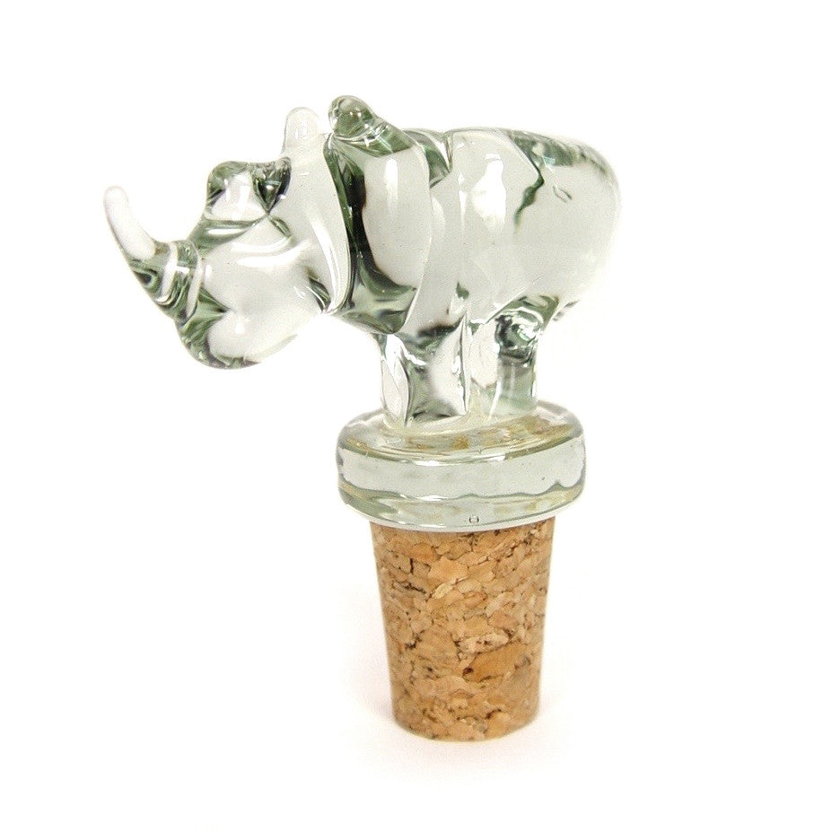 Animal-shaped glass wine stopper with clear figure and brown cork, lying side view