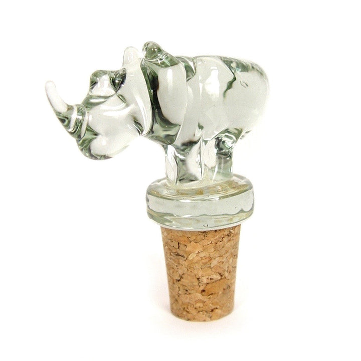 Animal-shaped glass wine stopper with clear figure and brown cork, lying side view