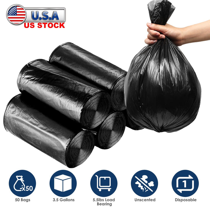 Black garbage bag rolls and a tied liner held by hand, disposable trash bags