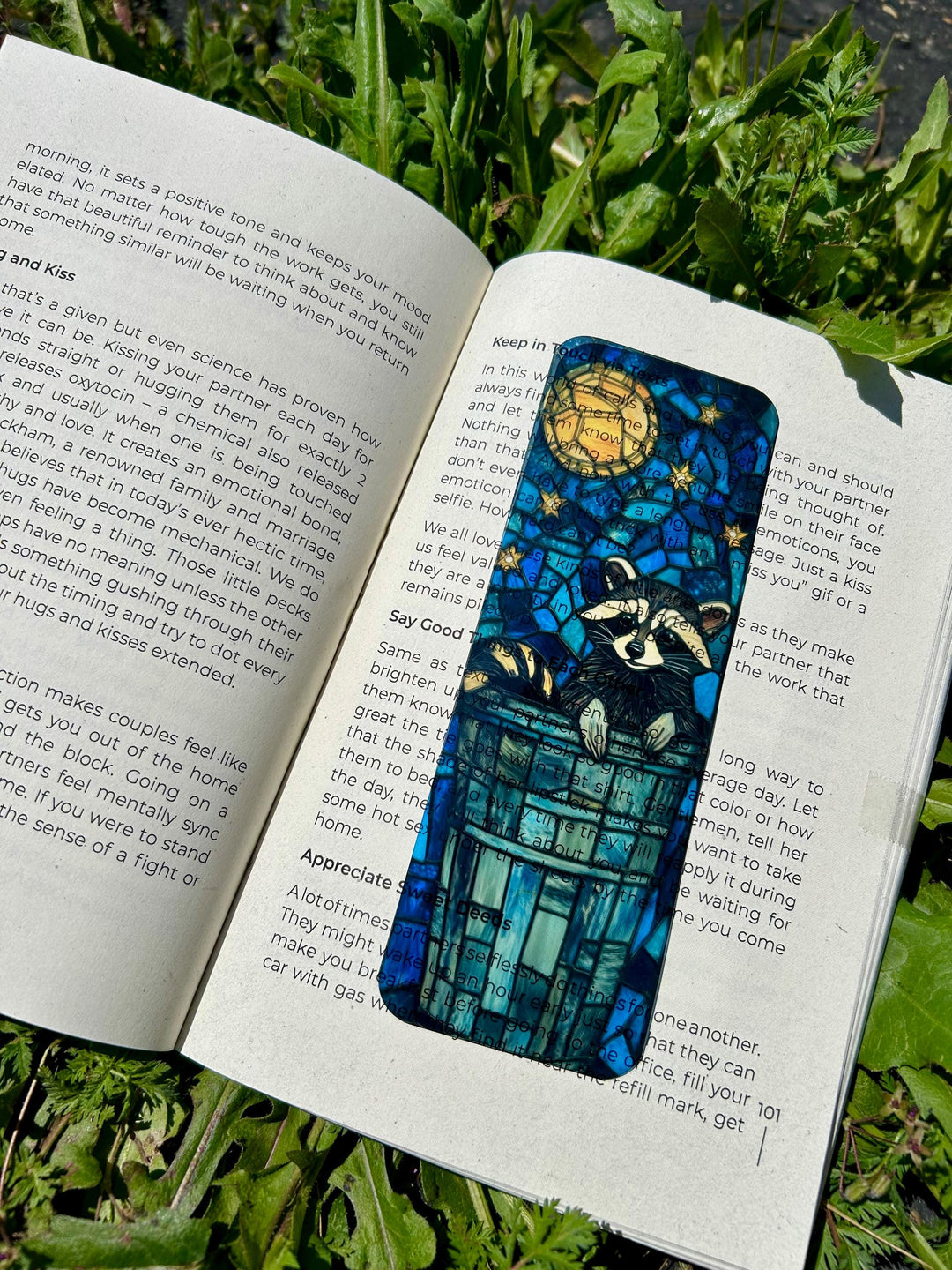 Blue raccoon bookmark with archway design and circular moon motif