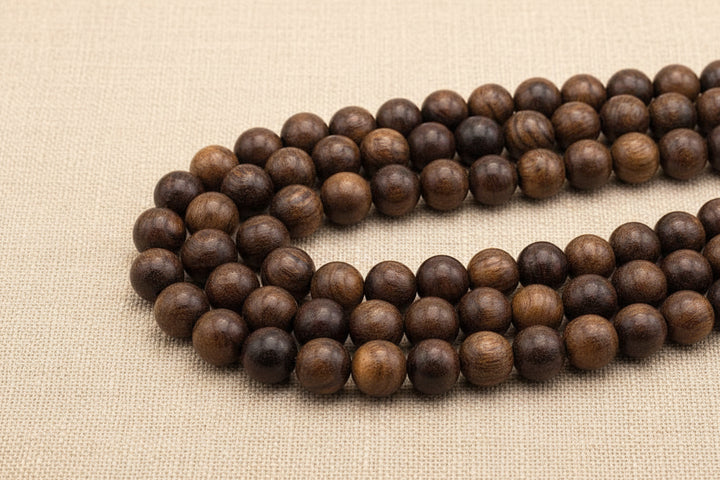 Natural brown round wood beads strand with visible wood grain, smooth surface