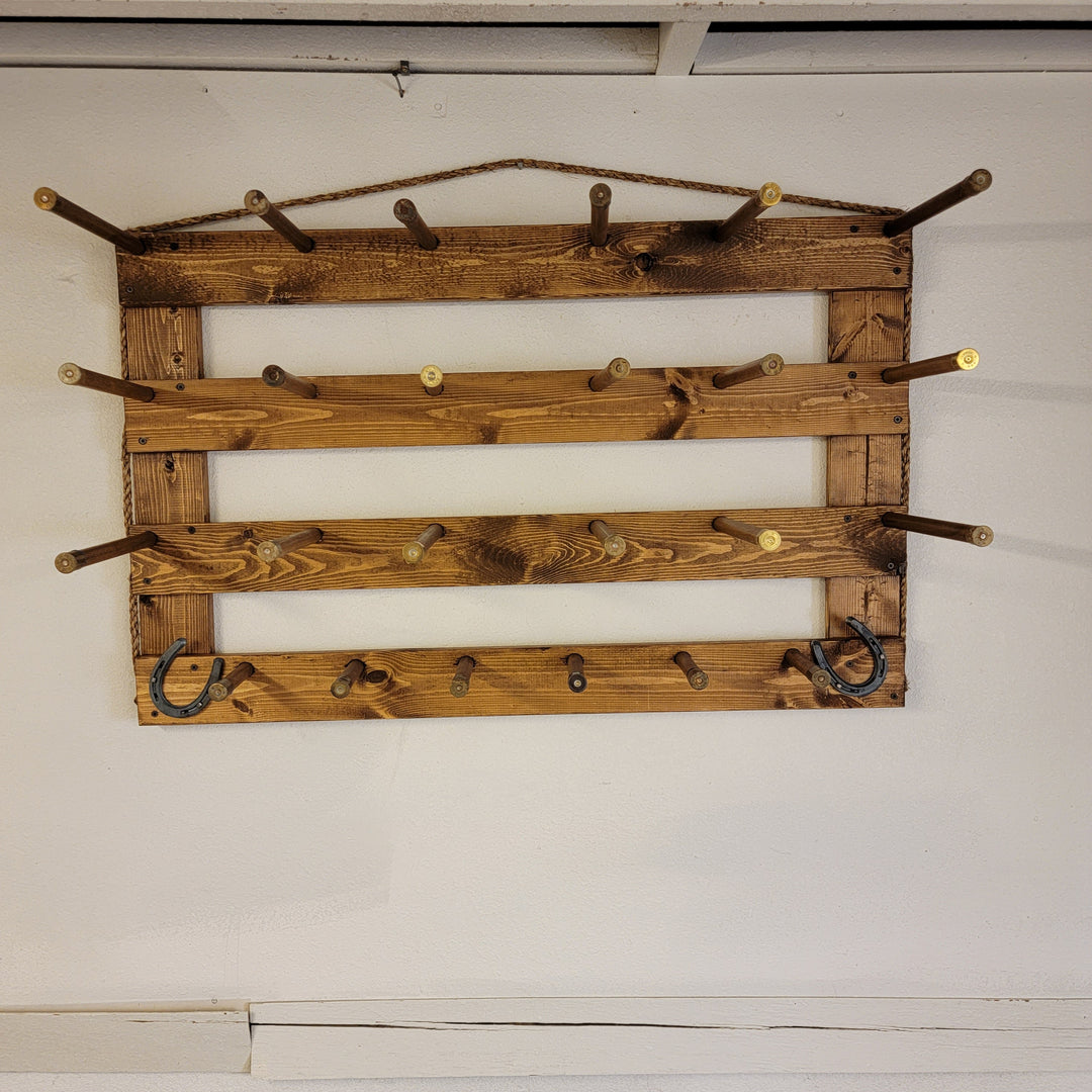 Horizontal wall hat organizer with peg arms and U-shaped hooks for accessories