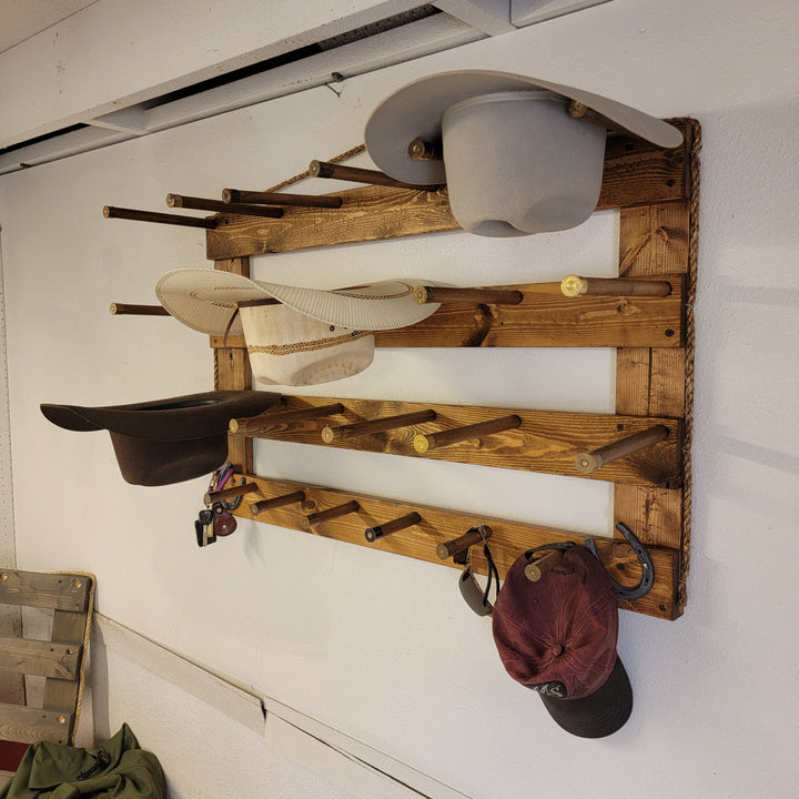 Wall hat organizer with gray and black hat cups plus peg arms and hanging hooks