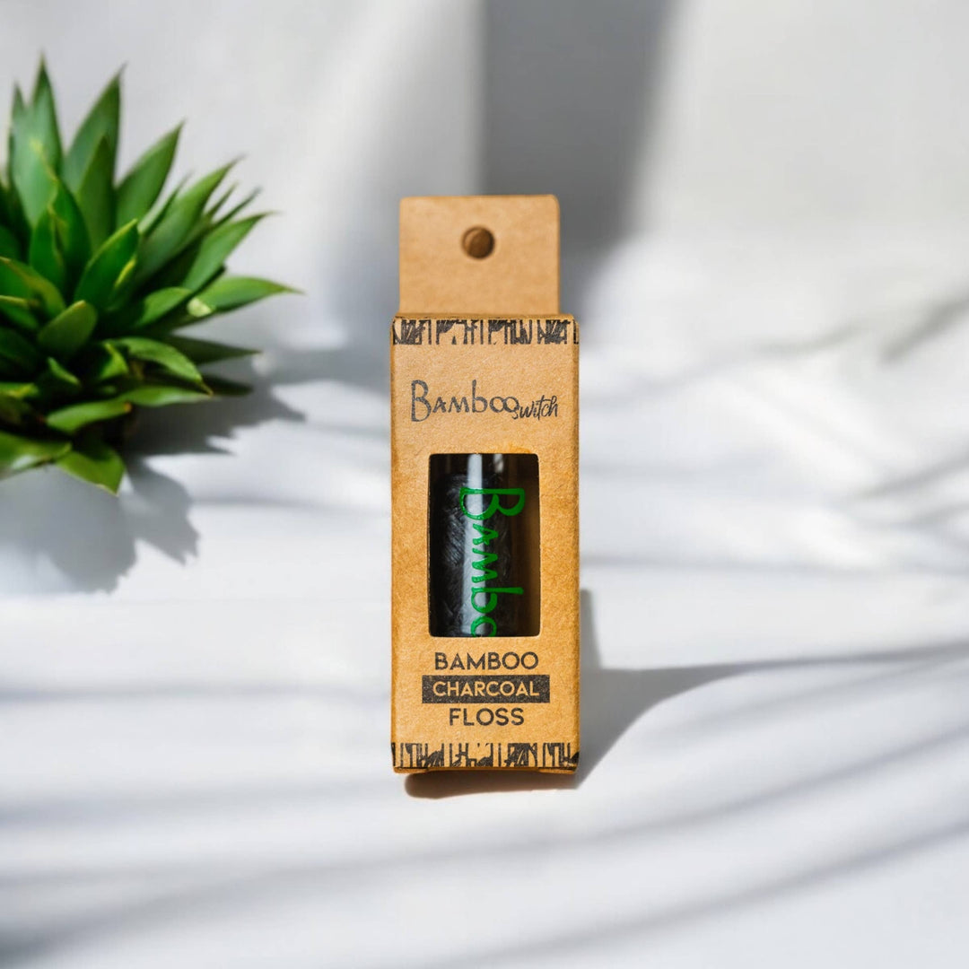 Charcoal bamboo floss pack with window and green BambooSwitch label