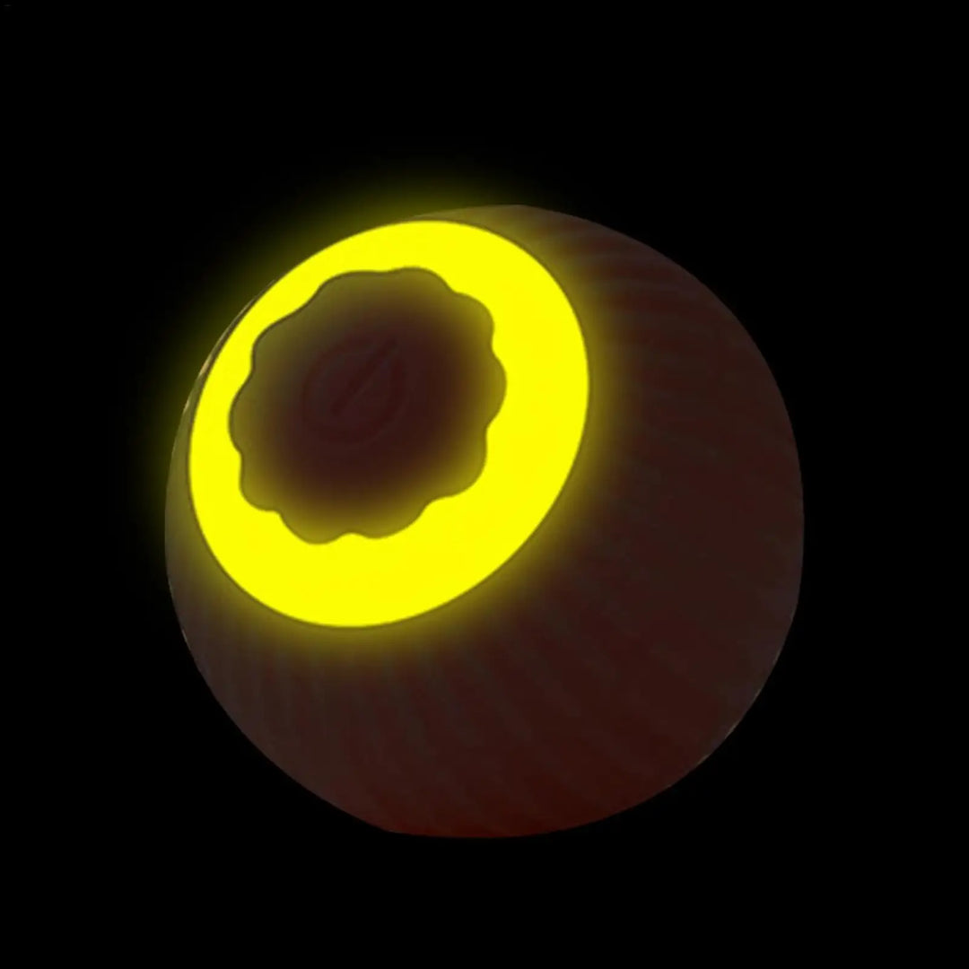 Yellow glowing rolling pet ball with bright light through the ball