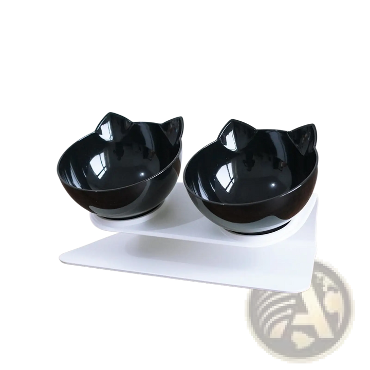 Tilted double cat bowl feeder stand with black bowls on a white base