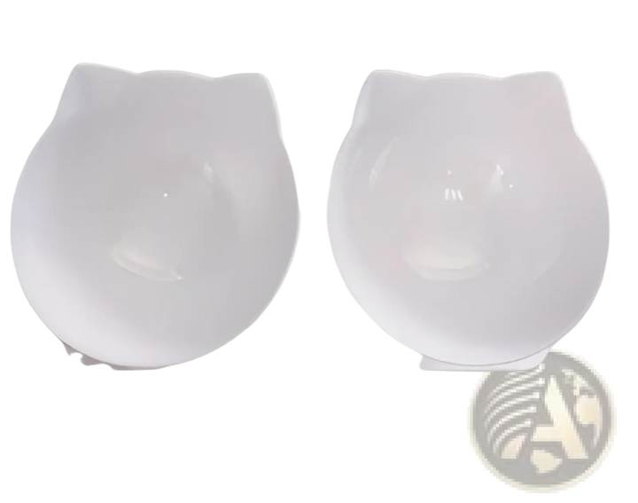 Tilted double cat bowl feeder stand with white bowls on a white base