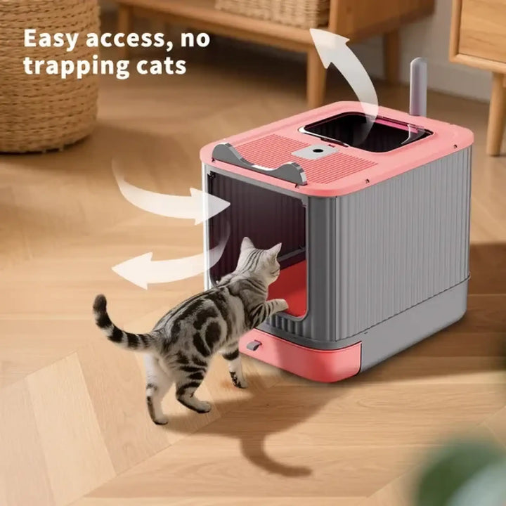 Pink and gray enclosed cat litter box with top entry opening and front access door