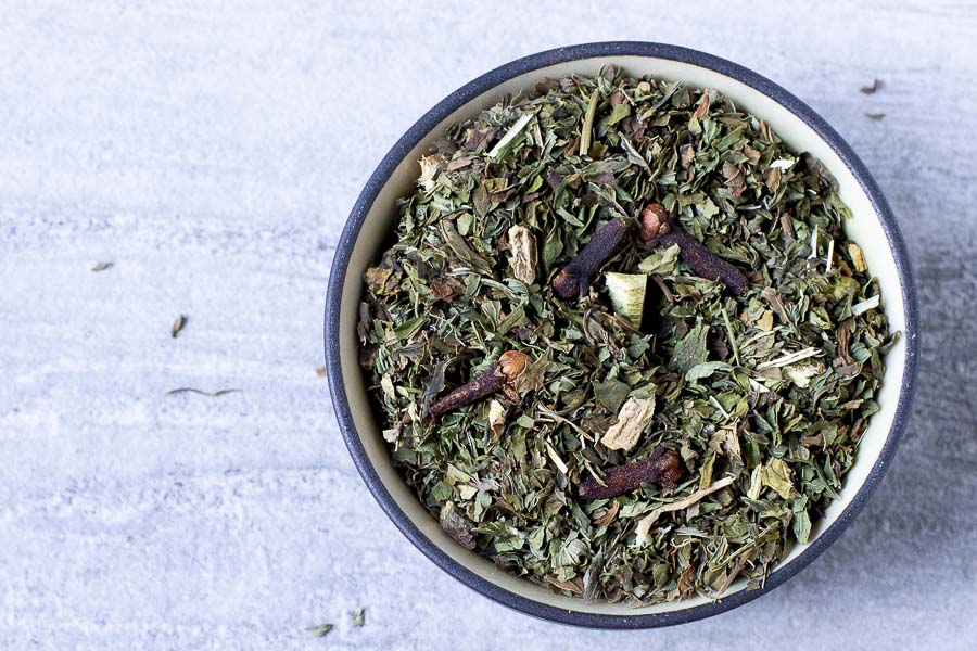 Tea tasting flight green loose-leaf blend in a blue ceramic bowl