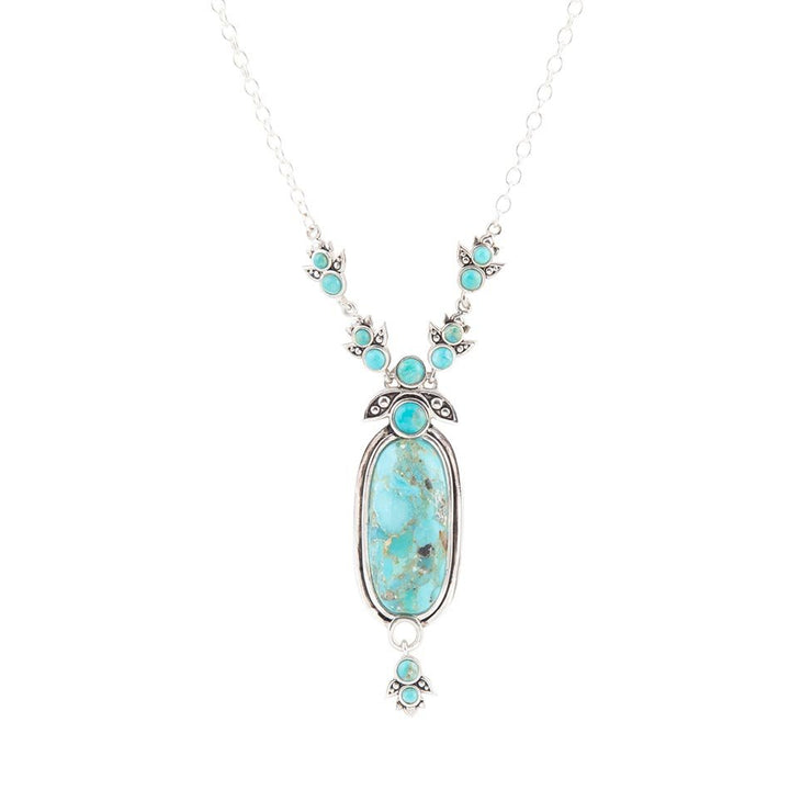Sterling silver pendant necklace with oval blue turquoise center and small turquoise accents