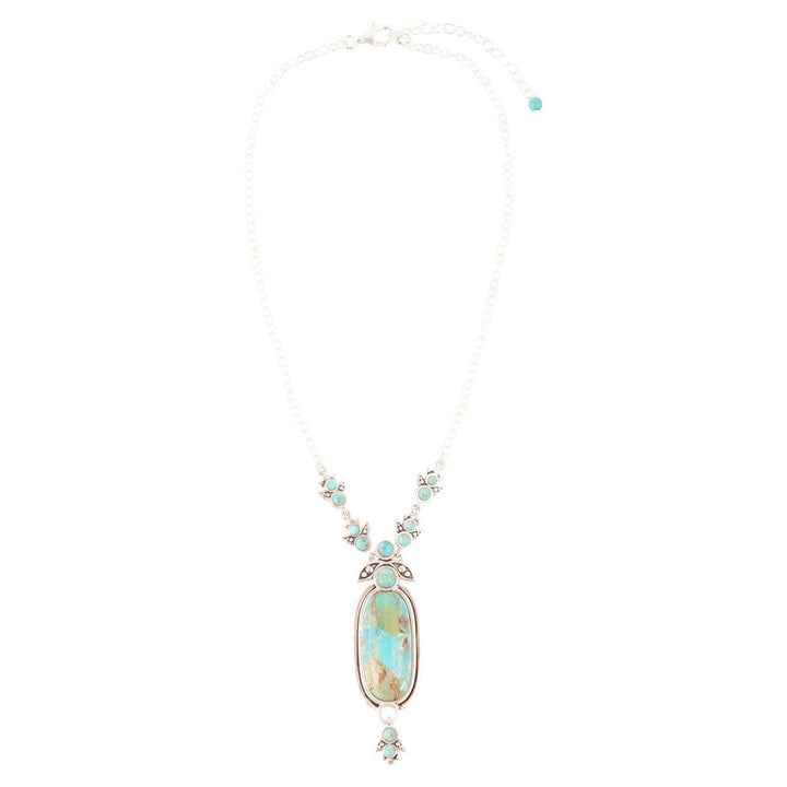 Sterling silver pendant necklace with oval blue turquoise pendant and small turquoise side stones
