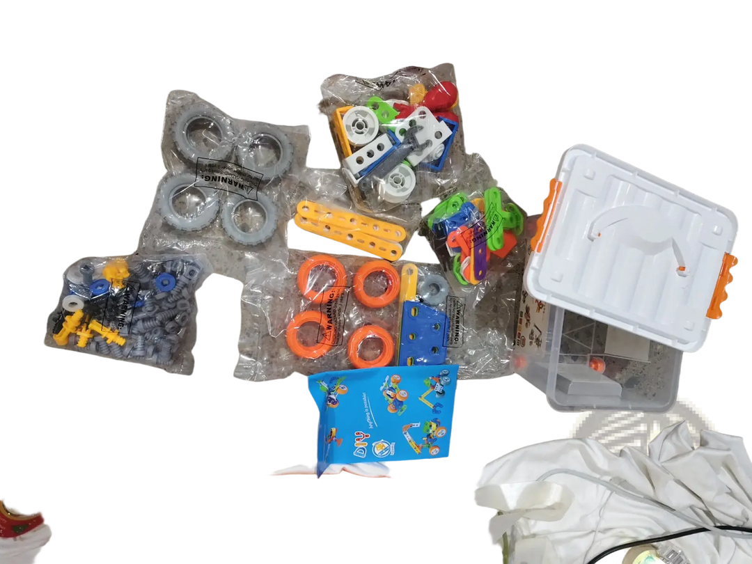 Robot building block parts kit in plastic bags and clear compartment tray