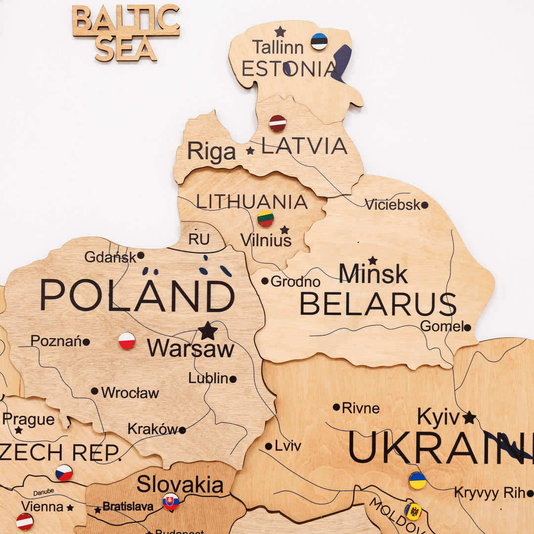Gold Europe wooden map board showing Baltic area, Poland, Belarus, and Ukraine