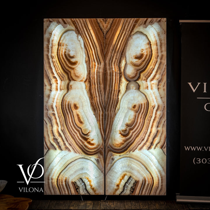 Onyx-style wall panel pair with gold, cream, and dark brown striped stone pattern