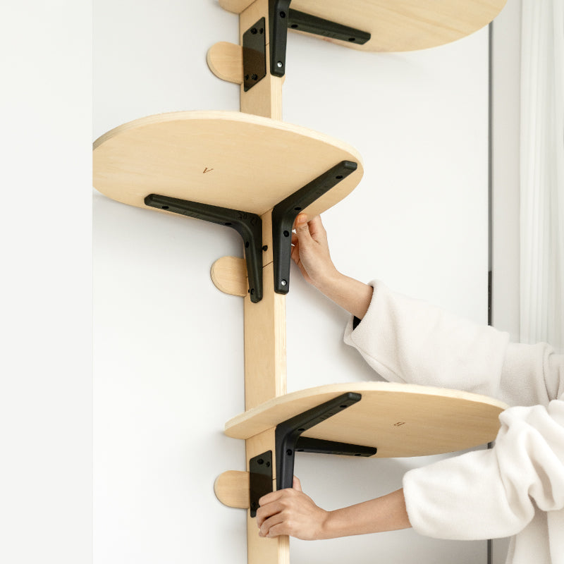 Door-mounted cat climbing frame with wood platforms and black mounting brackets