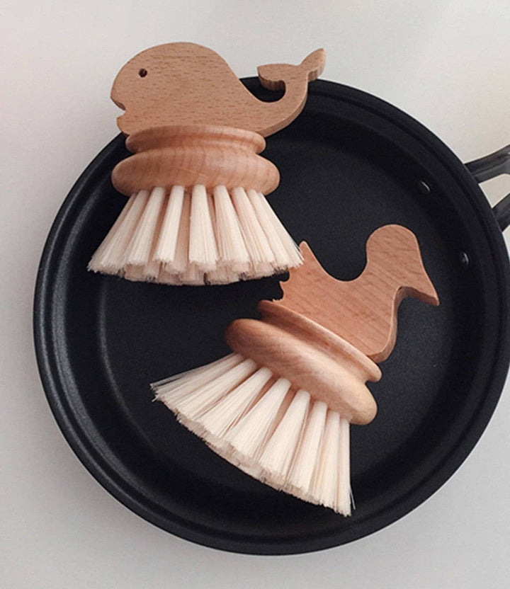 Set of two bird-shaped wooden kids cleaning brushes with white bristles