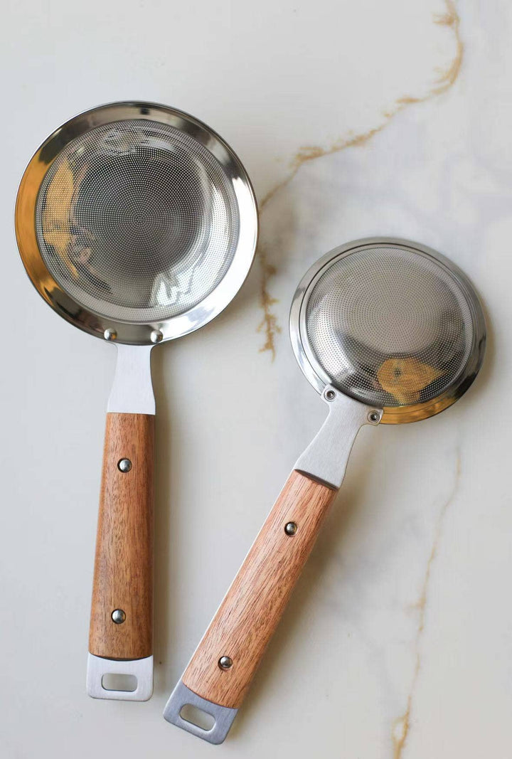 Two round mesh strainers with silver mesh screens and wood handles, large and small