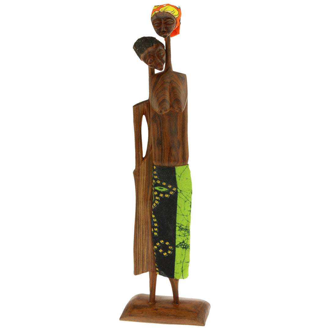 Sandalwood sculpture of a single standing figurine with carved face and green patterned cloth