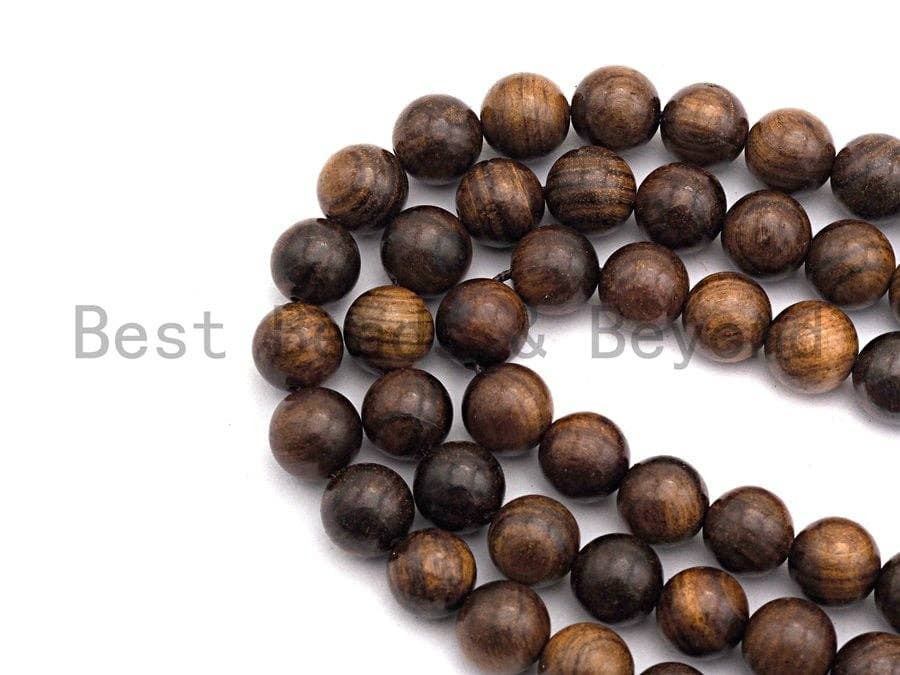 Natural brown round wood beads on a strand, smooth finish with wood-grain texture