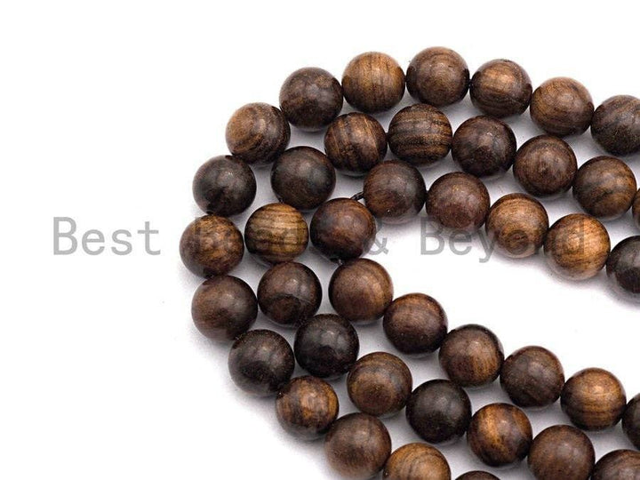 Natural brown round wood beads on a strand, smooth finish with wood-grain texture