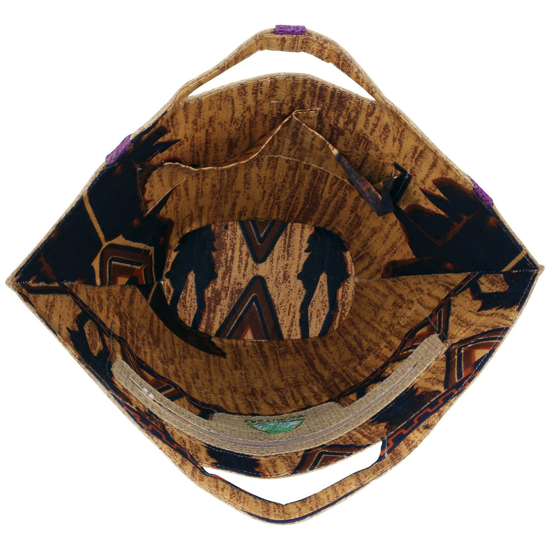 Raffia bag interior with brown lining and purple pattern on foldover top
