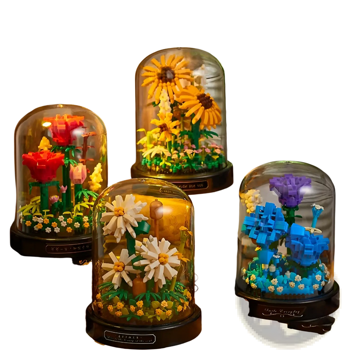 Multiple glass-domed bouquets: sunflower, red flowers, and blue-purple flowers
