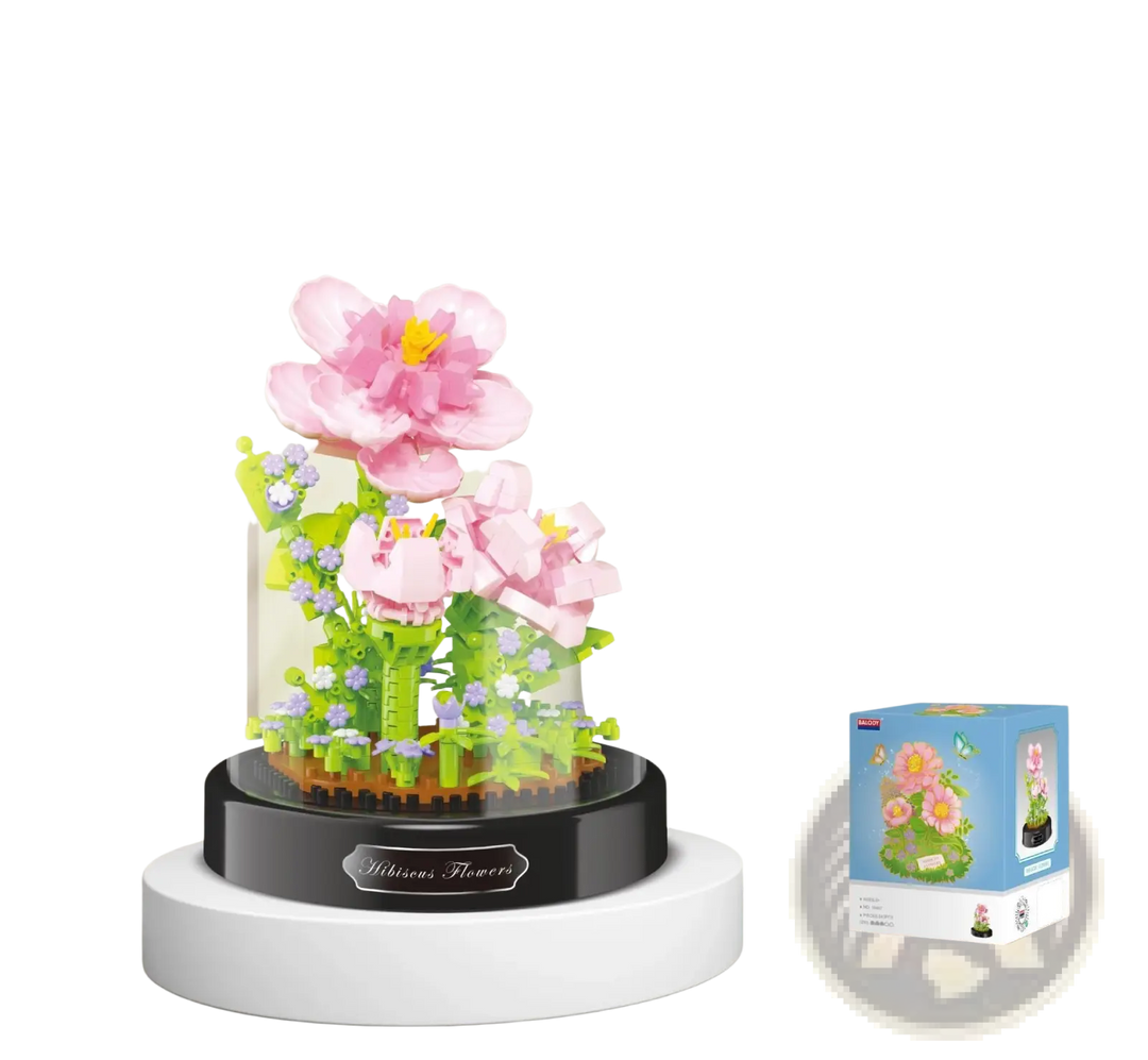 Pink blossom building block bouquet with green foliage on dark base