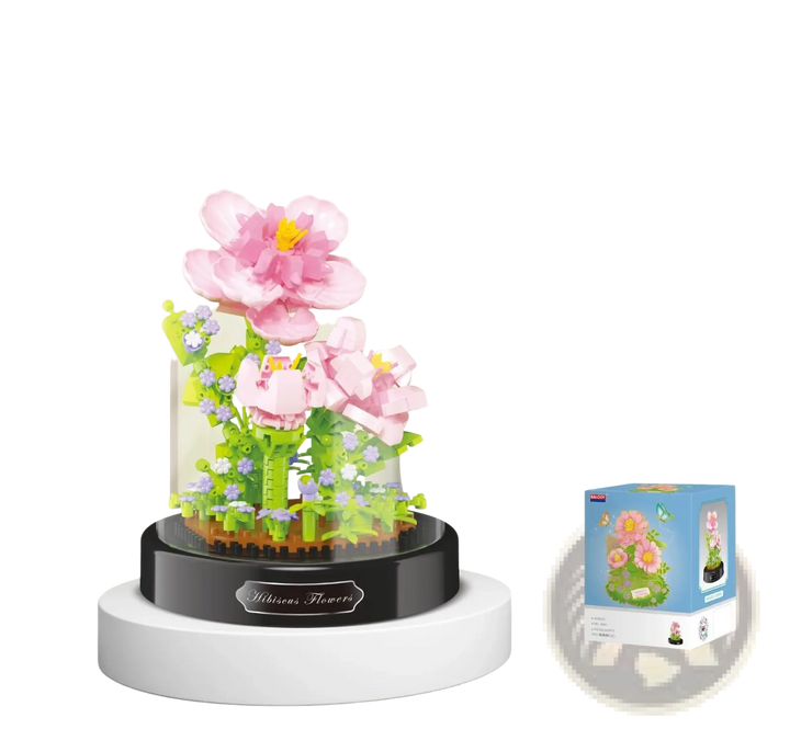 Pink blossom building block bouquet with green foliage on dark base