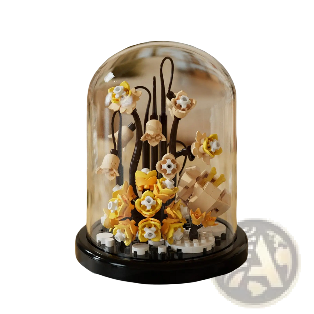 Flower building blocks under glass dome display case with cream and orange blossoms
