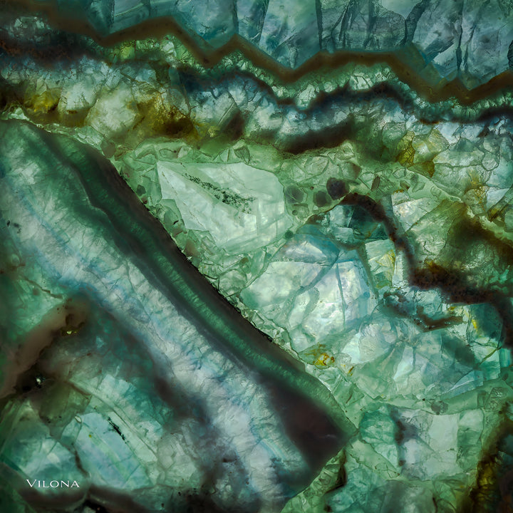 Close-up of the green translucent stone shade with swirling patterns and purple accents