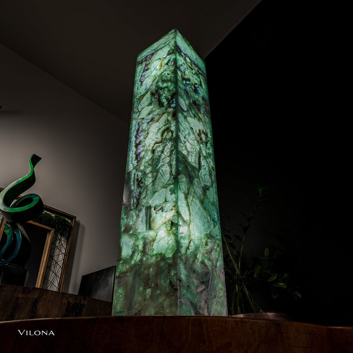 Tall narrow view of square fluorite floor lamp with green translucent stone and purple highlights