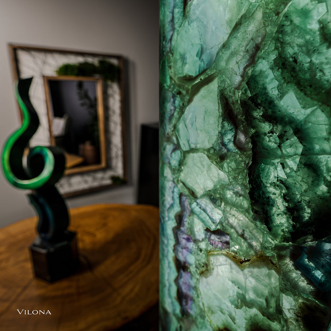Side view of square fluorite floor lamp showing green translucent stone texture and purple lines