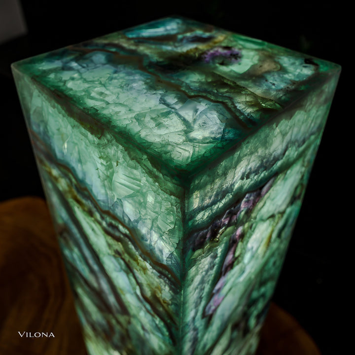 Fluorite floor lamp top surface in green translucent stone with dark ridges and purple flecks