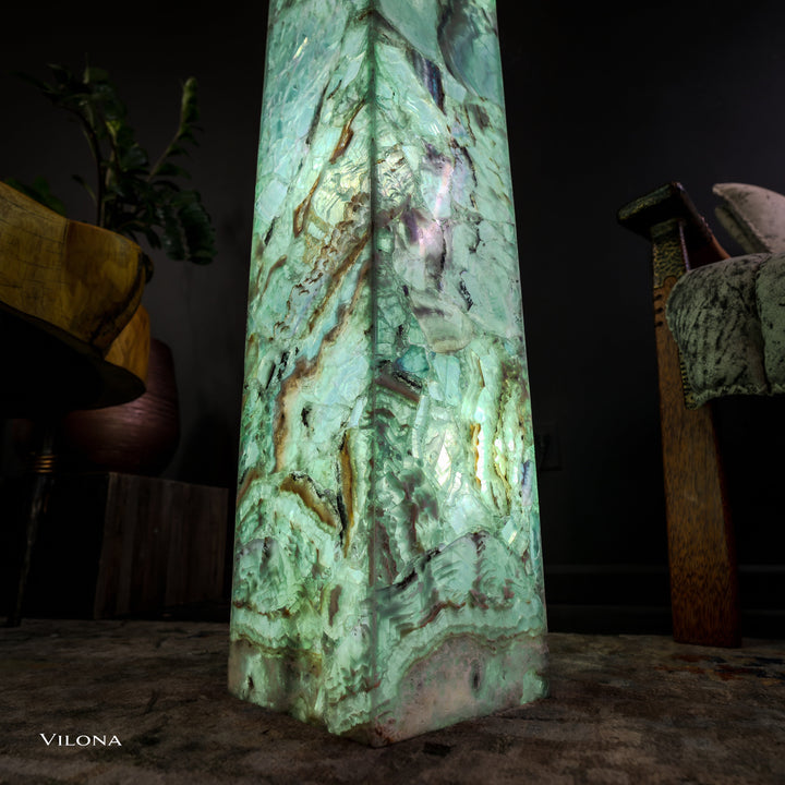 Medium fluorite floor lamp with glowing green square prism and uneven natural stone textures