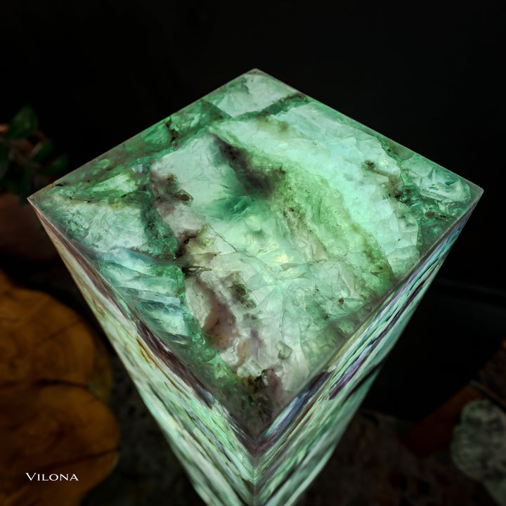 Top view of fluorite floor lamp showing glowing green square prism with faceted edges