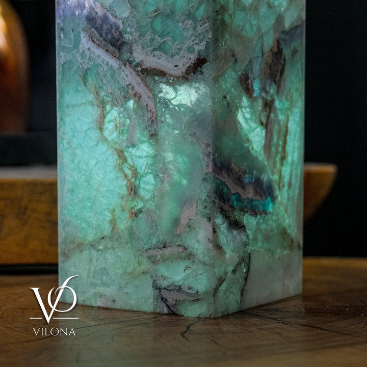 Close view of turquoise fluorite floor lamp with glowing cracked pattern