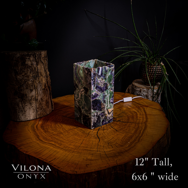 Miniature crystal table lamp with tall faceted green and purple prism shade, visible cord