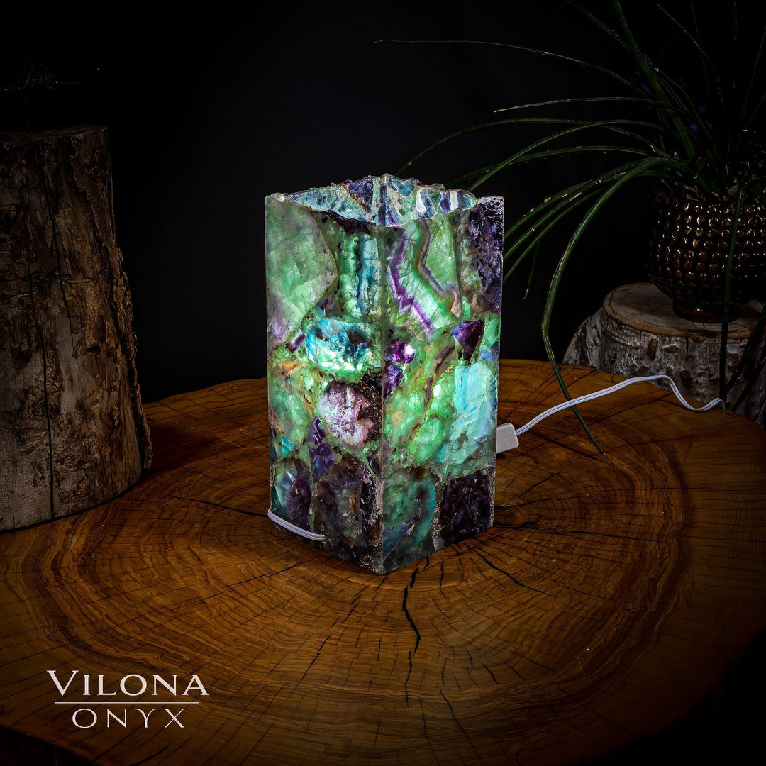 Miniature crystal table lamp with multicolor faceted prism shade and power cord at base