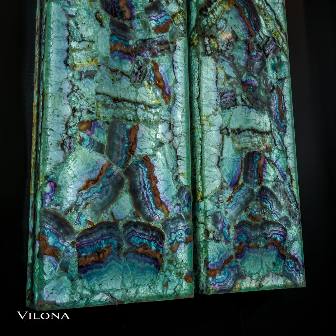 Two fluorite crystal wall panels, teal stone with deep purple and brown streaks