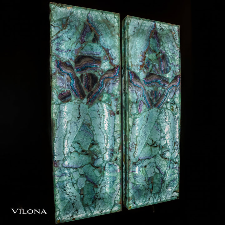 Teal fluorite wall panels with marbled cracks and violet-blue highlights, vertical pair