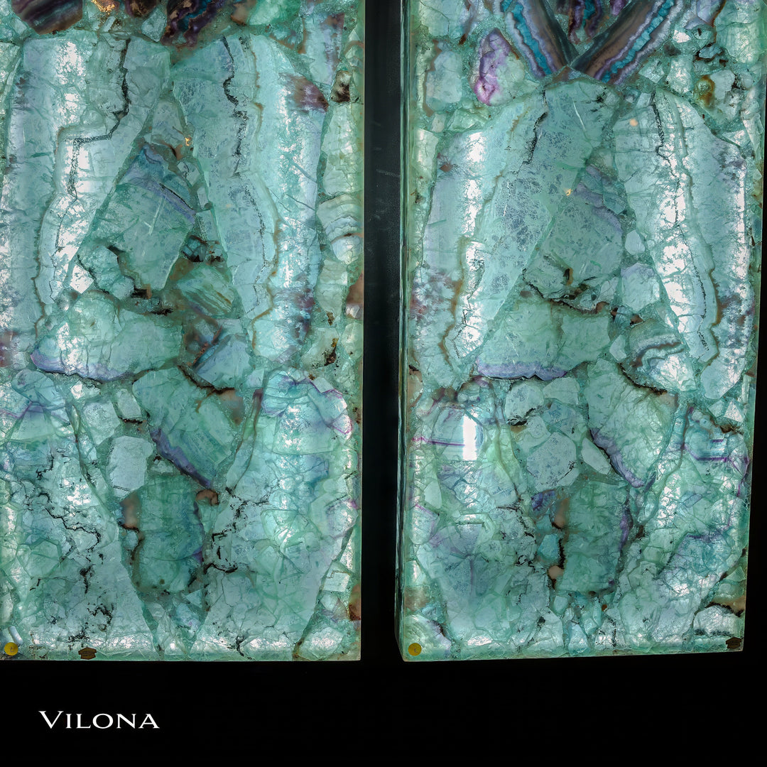 Teal fluorite crystal wall panels with green marbling and iridescent purple-blue accents, vertical
