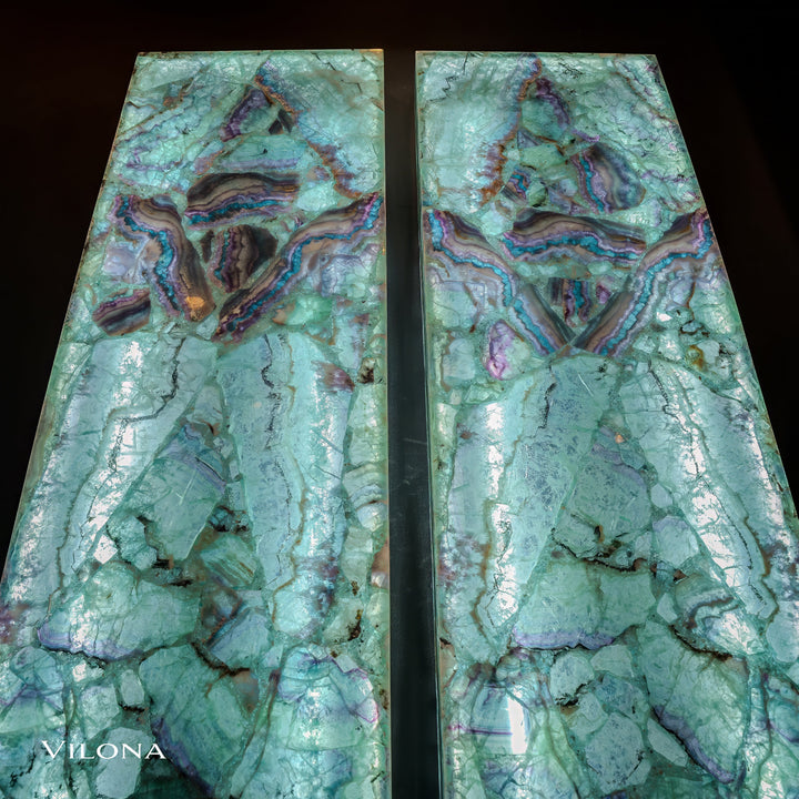 Close view of teal fluorite wall panels with swirl patterns, purple-blue bands