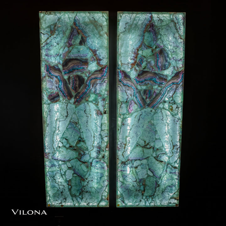 Vertical pair of teal fluorite wall panels with bold purple-blue crown-like center