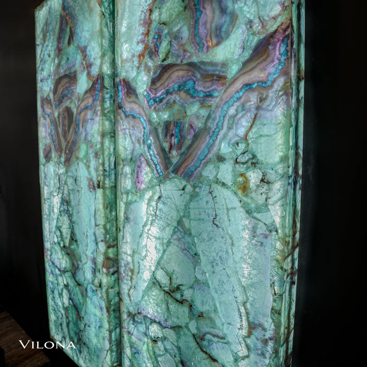 Fluorite crystal wall panel in light teal with purple and gold marbling