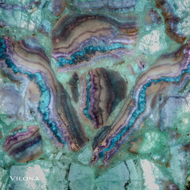 Macro view of teal fluorite crystal with thick purple, blue, and tan agate bands