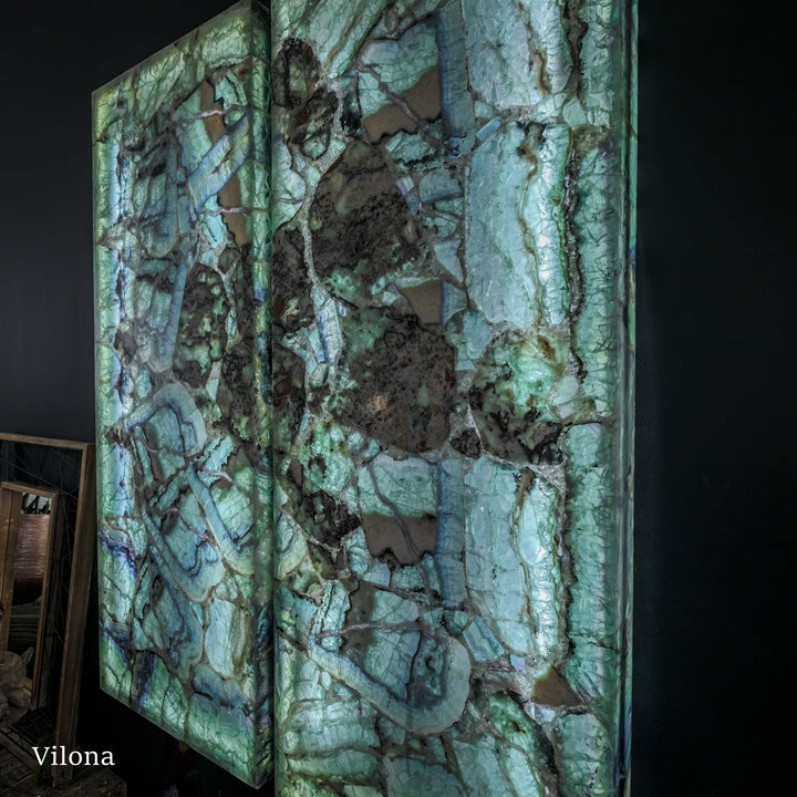 Fluorite crystal wall panel pair with glossy turquoise-green marbling and black specks