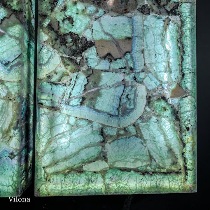 Fluorite wall panel with mint green and pale blue veining, dark mineral gaps
