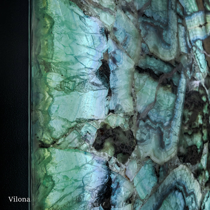 Fluorite wall panel pair with green and blue crystalline veining, dark stone border